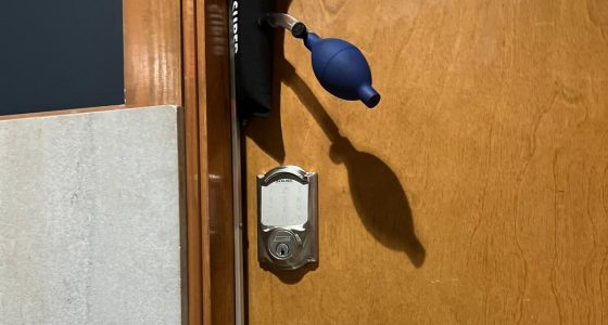 a door with a blue enema requires residential locksmith services