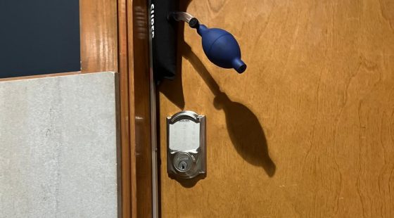 a door with a blue enema requires residential locksmith services